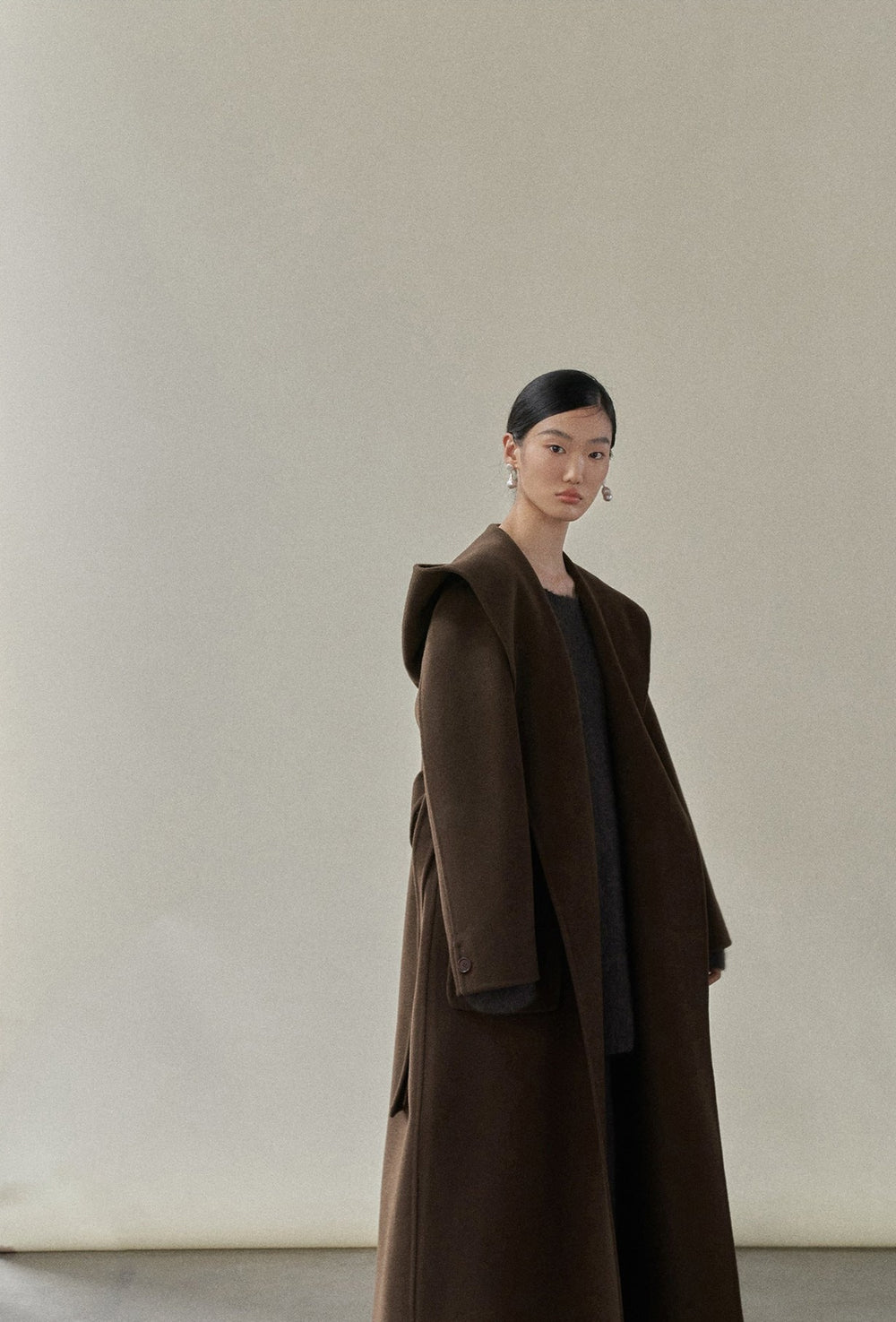 Front view of the chocolate robe coat, emphasizing its rich, warm color and luxurious wool texture.