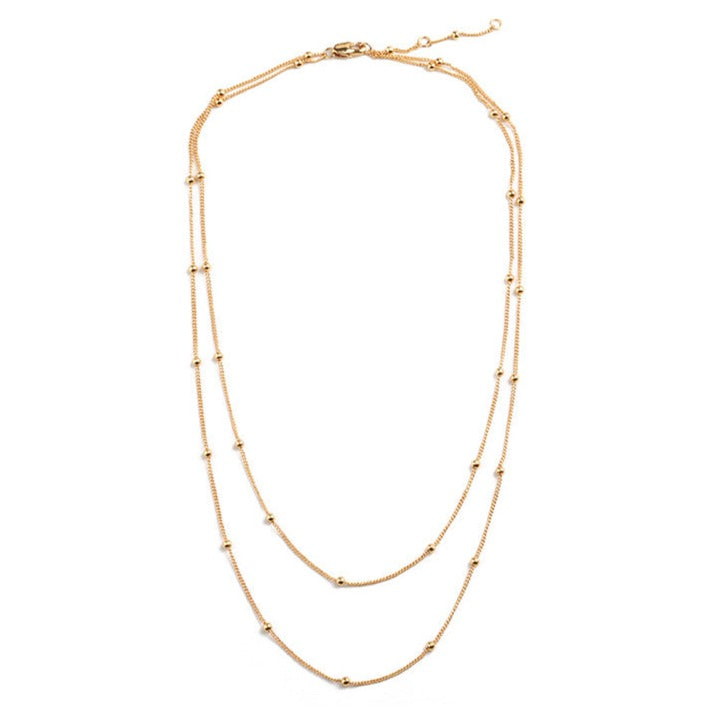 A timeless double-layer chain necklace with gold beads