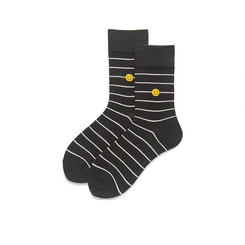 This pair of black and white striped socks with a smiley face is Ideal for anyone looking to add a cheerful twist to their outfit.