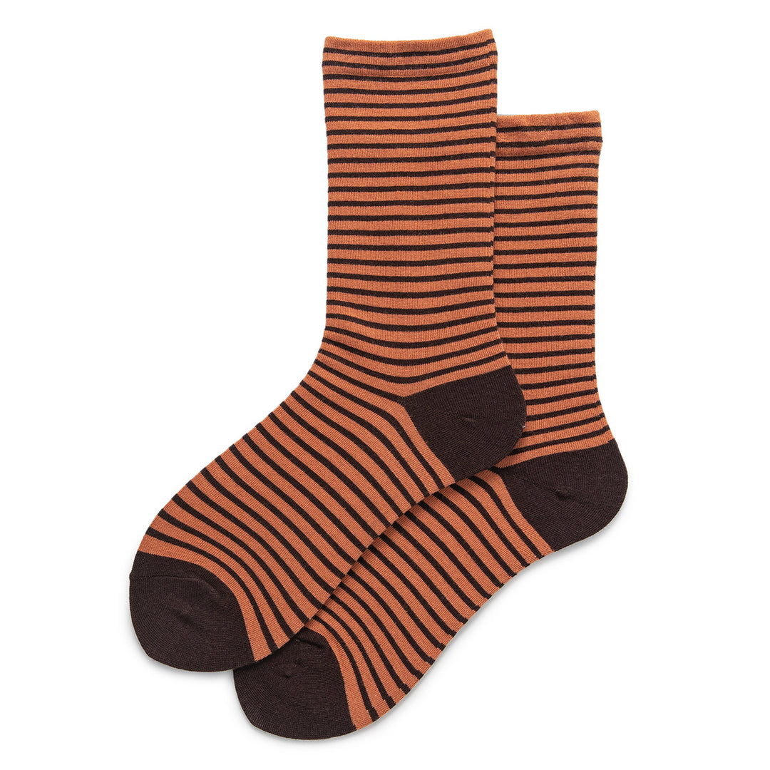 This pair of warm-toned socks features an inviting orange base with rich dark chocolate-colored stripes.