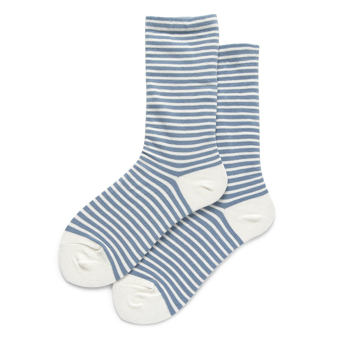 This pair features serene light blue stripes against a backdrop of crisp white, from heel to toe.