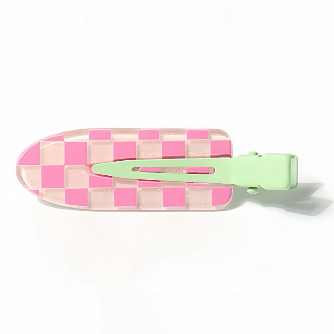 A close-up of the Pink Chessboard Resin Hair Clip, featuring a playful mix of light and bright pink squares arranged like a chessboard.