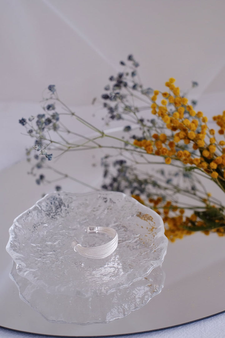 Side view of the Silver Ripples ring, showing the intricate ripple design and wide open back.