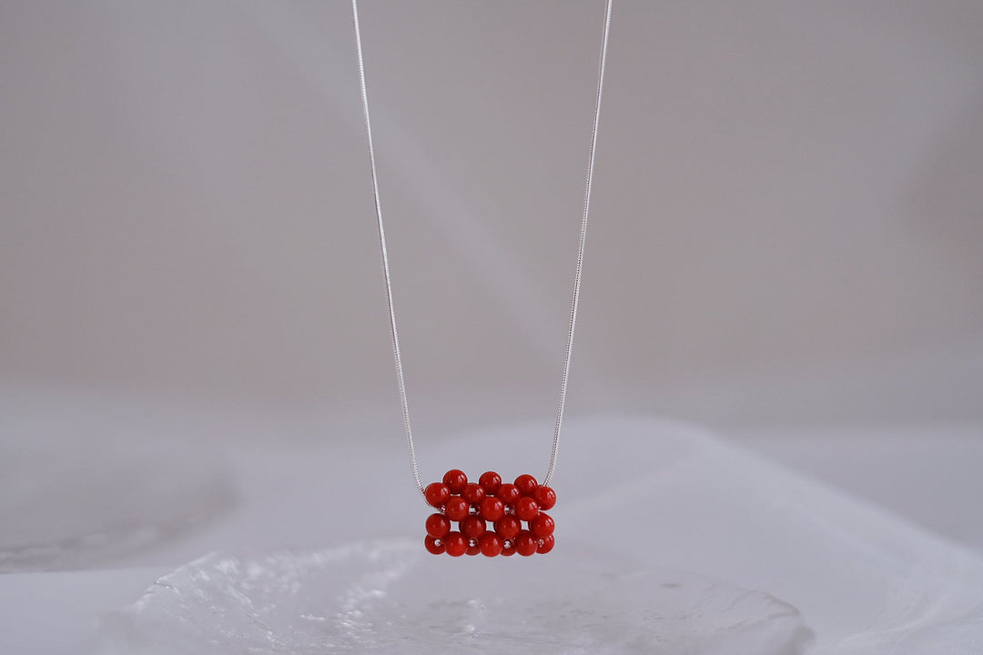 Detailed shot of the red beads on this necklace.