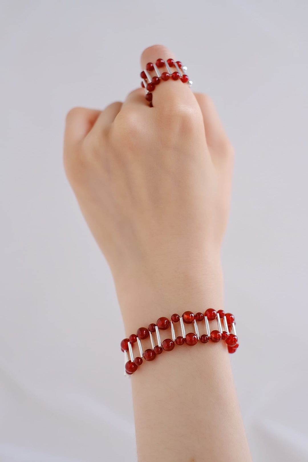 The sleek sterling silver setting and vibrant red onyx stone make a stylish statement piece for any occasion.