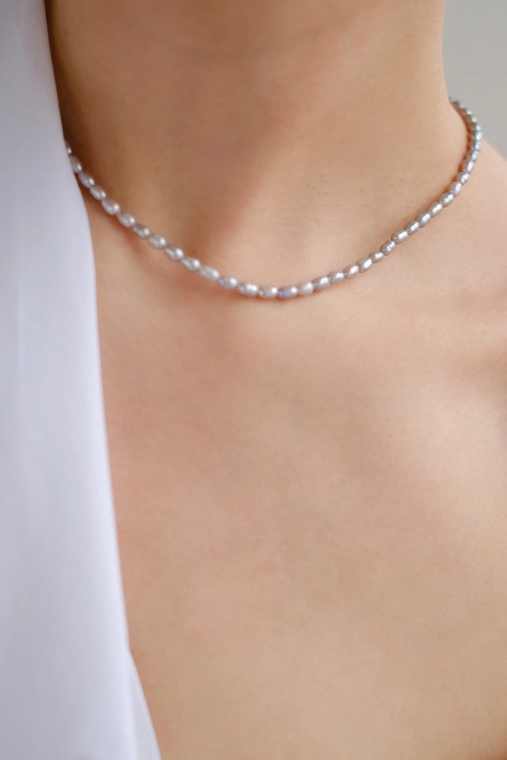 Graceful and timeless, the necklace complements any ensemble with its understated beauty.