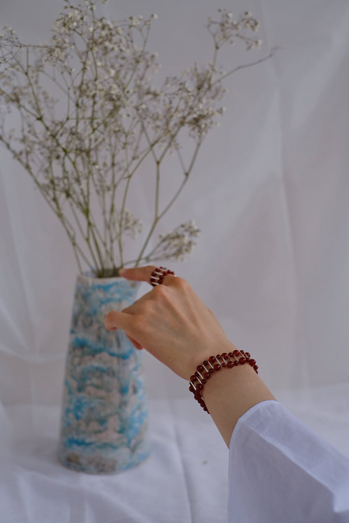 The vibrant red onyx beads and sterling silver clasp add a touch of opulence to any ensemble, while the healing properties of red onyx provide a sense of empowerment and resilience.