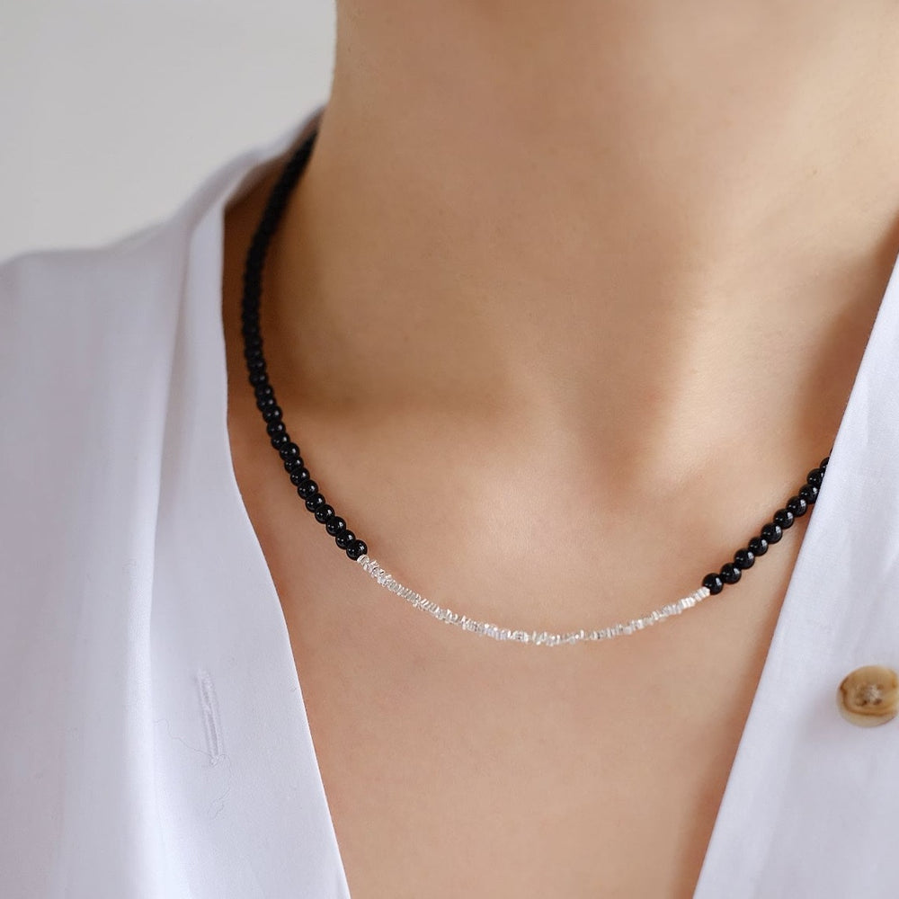 A model wearing the Glacial Elegance necklace, demonstrating its perfect fit and how it complements any outfit.