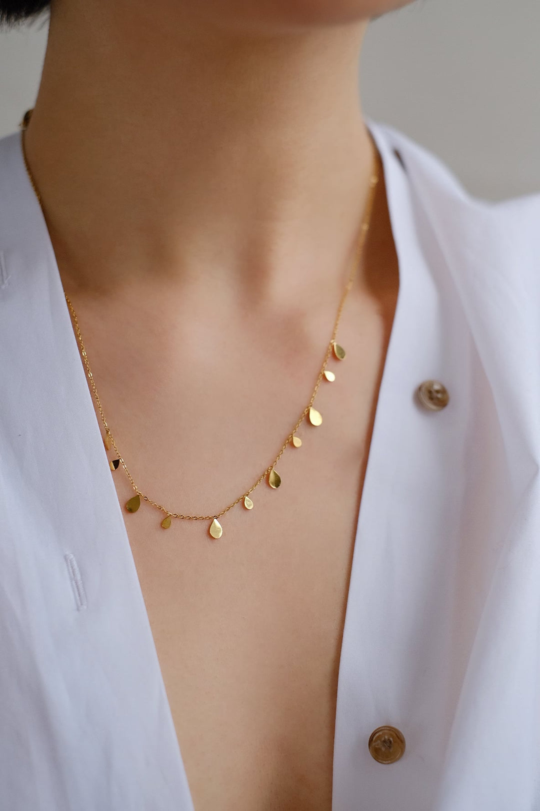 Whether you're dressing up for a special event or adding a touch of sparkle to your daily ensemble, the Sunlit Rain necklace offers versatile style.