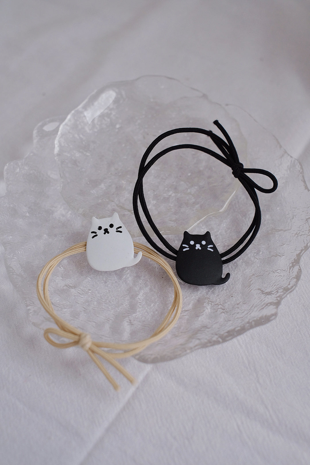 The black and white cartoon cat designs offer a fun and playful accessory option for cat lovers of all ages.