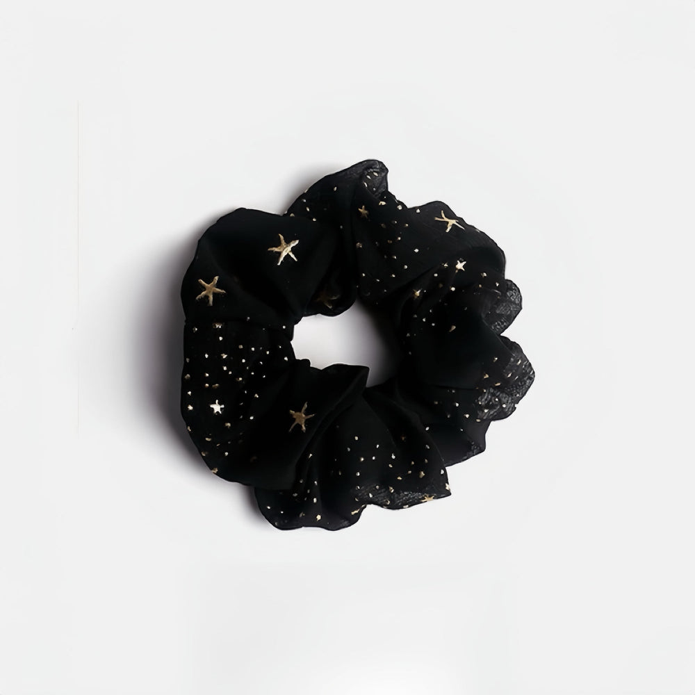 Embrace the magic with this black twinkle stars scrunchie, a cool accessory suitable for everyday wear or Halloween!