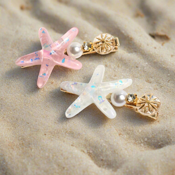 Starfish hair clips displayed in a beach-themed setting, evoking a playful and ocean-inspired vibe.