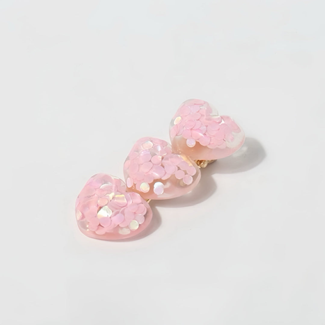 Close-up of the glitter detail on the heart-shaped clips to emphasize their playful style