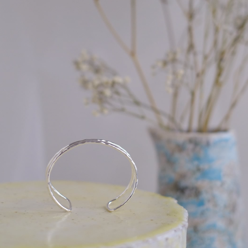 Indulge in the beauty of simplicity and sophistication with the Armor Sterling Silver Bangle, a true testament to refined style and timeless appeal.