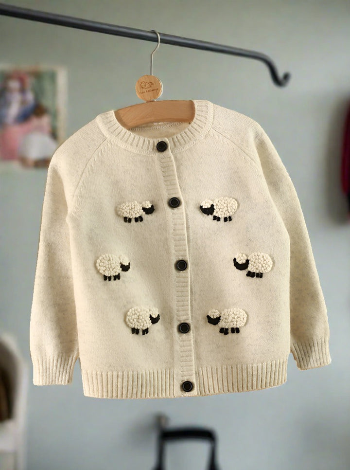 This off-white children's cardigan features cute sheep patterns, perfect for boys and girls alike.