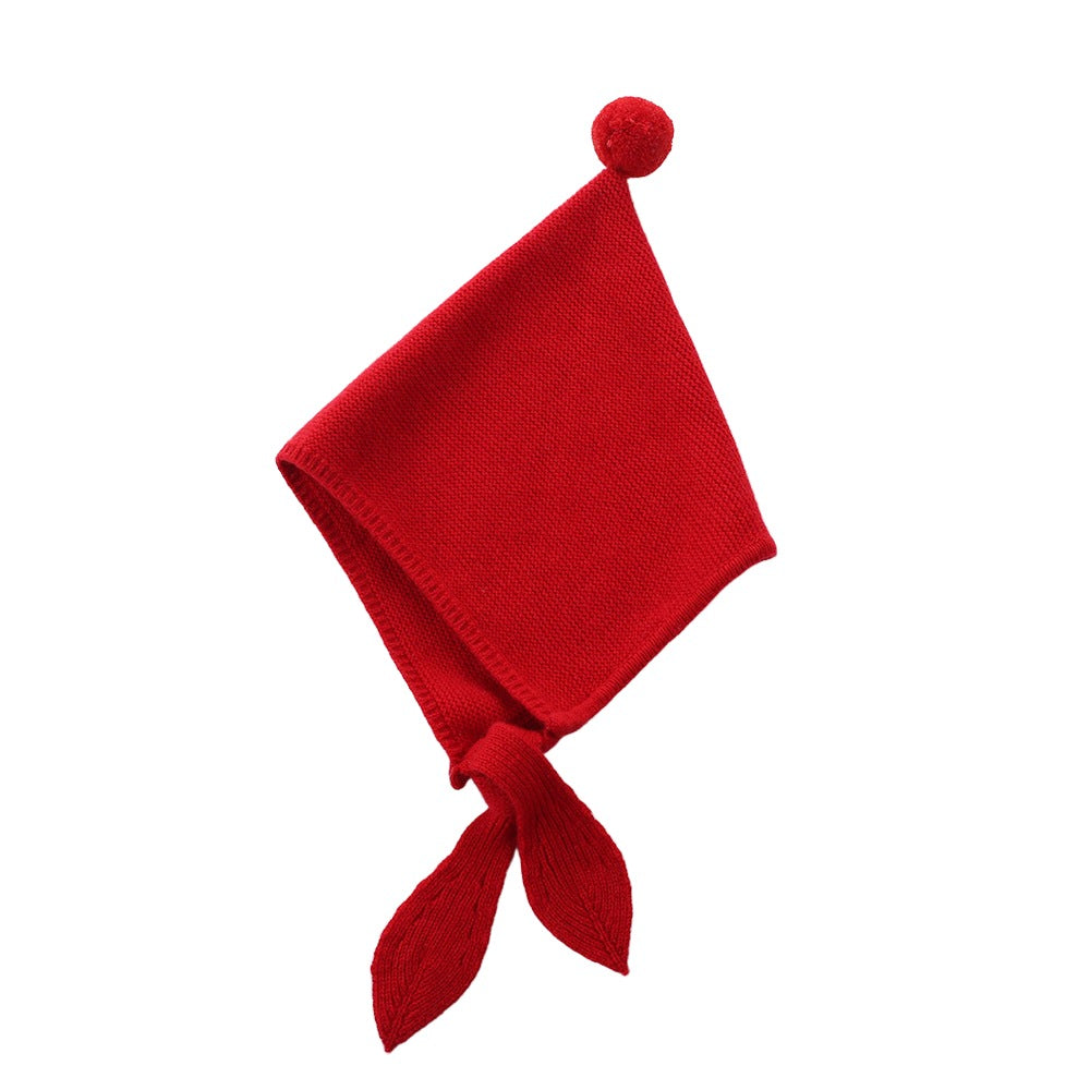 This cashmere hat is available in bright red, adding a pop of color to your children's cold winter days.