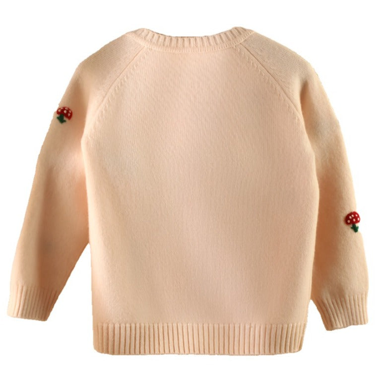 The back view of our children's pink cashmere cardigan highlights its classic silhouette and timeless elegance.