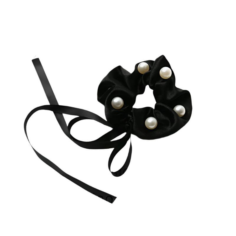 A statement soft scrunchie that is perfect for a special occasion hairdo.