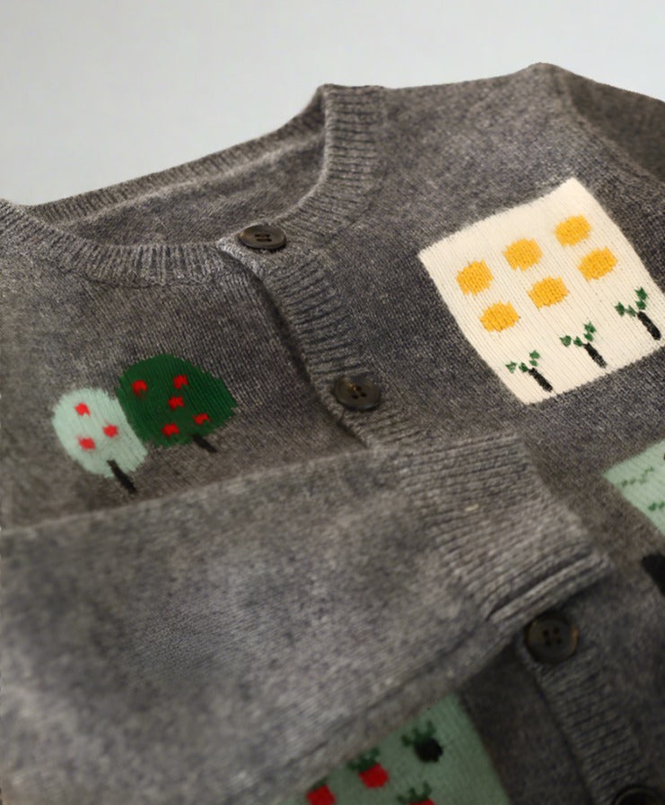 Close-up of the intricate details of our "Our Garden" cardigan, showcasing its premium craftsmanship.