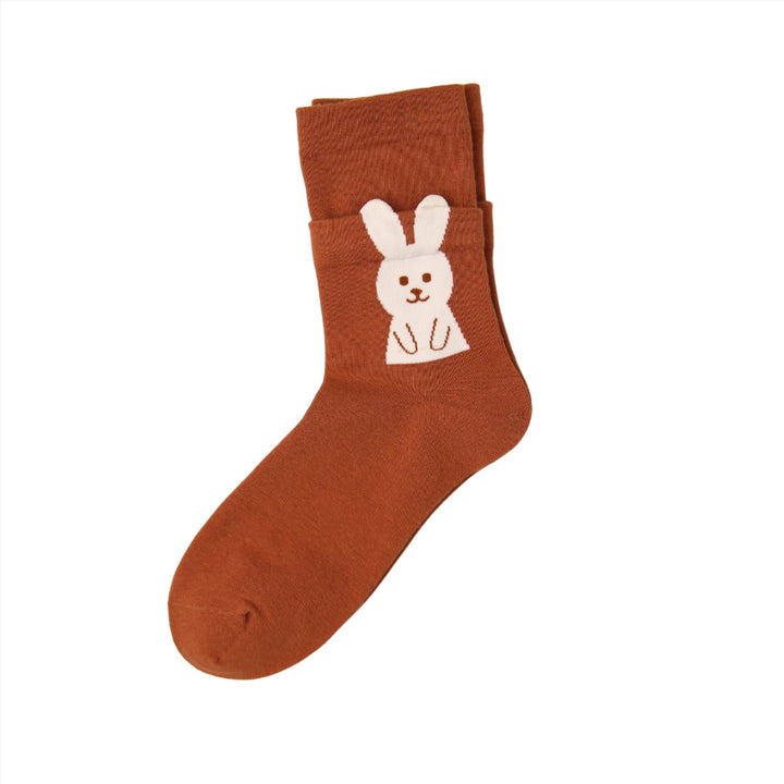 The cinnamon-colored sock features a white bunny with 3D ears extending beyond the ankle edge, adding a playful touch to your outfit.