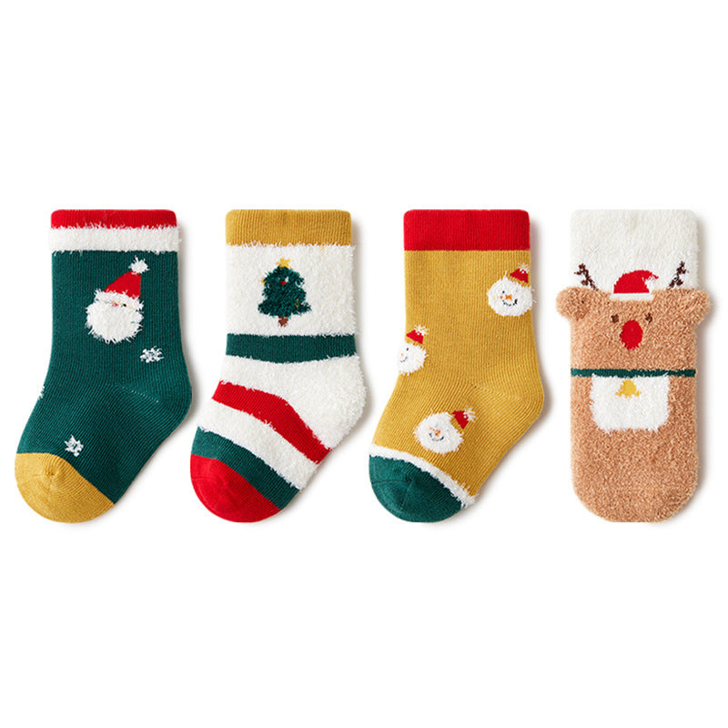 A display of all four pairs of socks showcasing the unique Christmas-themed patterns, including Santa, Christmas trees, and Rudolph.