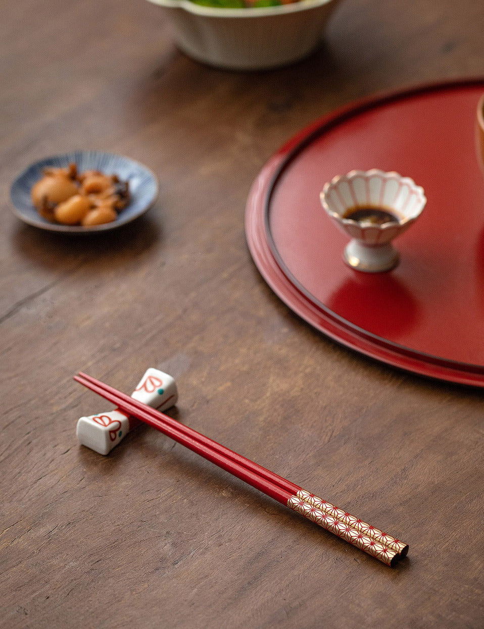 A pair of the chopsticks set on a dining table, demonstrating their practical and ergonomic design.